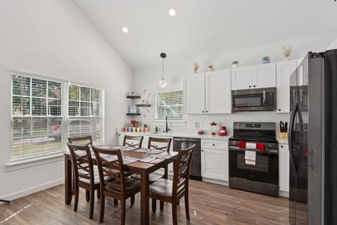 Open concept with Dining Table for 6, dishware for 10+ to include children's dishware, fully stocked kitchen, comfy reclining sofas, full-size arcade system, Smart TV, and Xbox
