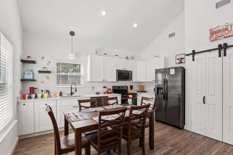 Open concept with Dining Table for 6, dishware for 10+ to include children's dishware, fully stocked kitchen, comfy reclining sofas, full-size arcade system, Smart TV, and Xbox