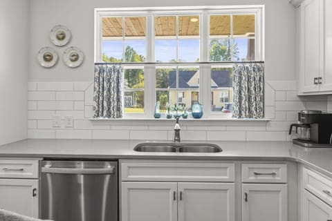 Kitchen window overlooking front porch