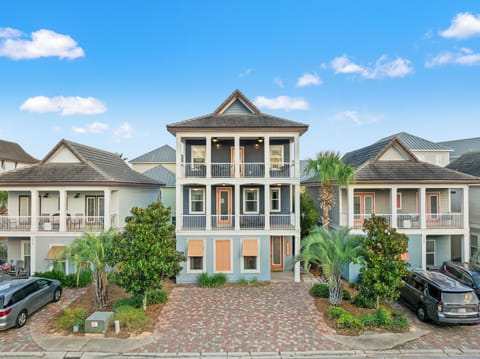 Welcome to Tahitian Way — a rare 5BR/4BA designer home in Destin's Villages of Crystal Beach with custom wall murals, a fenced yard, and a private feel in a gated resort community.
