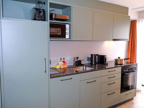 Kitchen Appliance, Kitchen, Cabinetry, Countertop, Kitchen Sink, Major Appliance, Furniture, Interior Design, Flooring, Sink