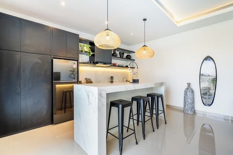 A bright, modern kitchen with top-tier appliances, clean lines, and an open layout designed for effortless cooking and entertaining. #Villa Bratan