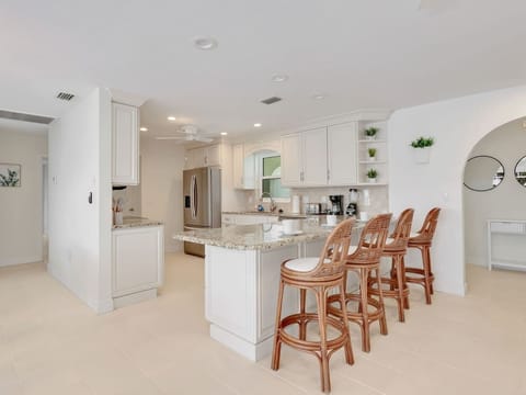 View from the living room into the kitchen and eat at counter
