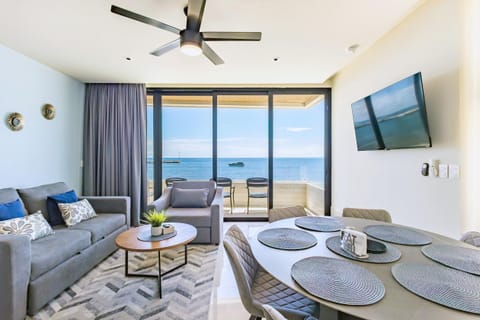 Bright living room with ocean views and cozy seating