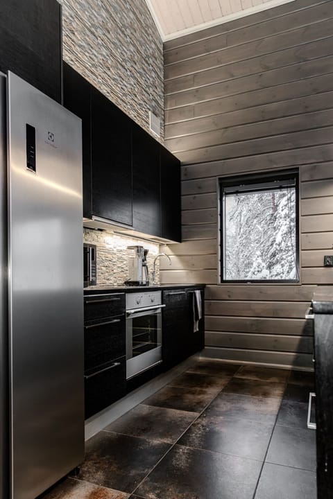 The villa features a fully equipped open kitchen with high-end appliances and all the cookware you need.