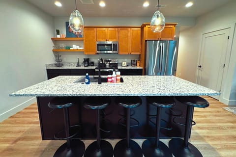 The kitchen island is the perfect spot to prepare a meal, enjoy a drink, or hangout with friends and family.