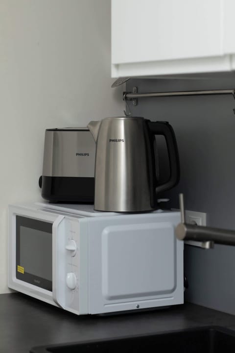 A close-up of a modern coffee machine. A convenient amenity for guests who enjoy fresh coffee.