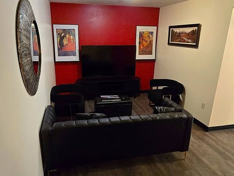 Relax after a day in the city with a comfortable lounge area, large smart TV, and cozy modern seating