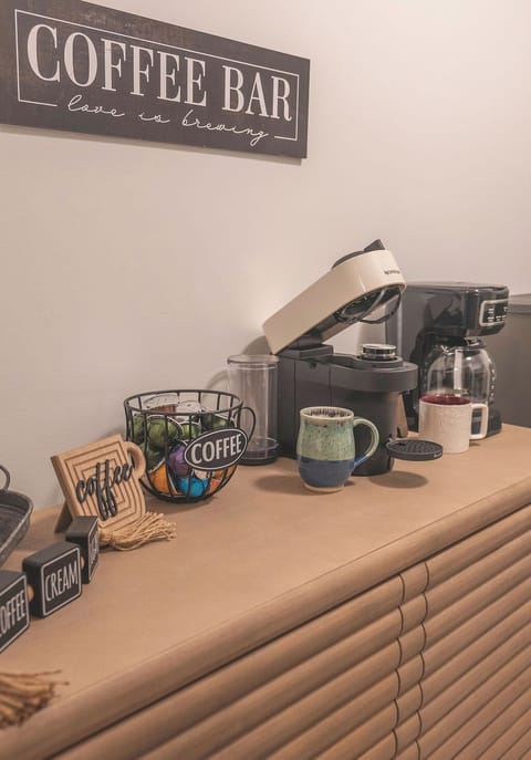 Start your day at the fully stocked coffee station featuring Nespresso and drip coffee makers.