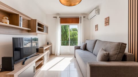 Modern living area with a comfortable sofa and flat-screen TV
#TaviraViews #FamilyFriendly #BalconyLiving