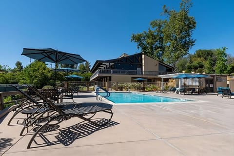 Lounge in the sun with resort-style seating and shade.