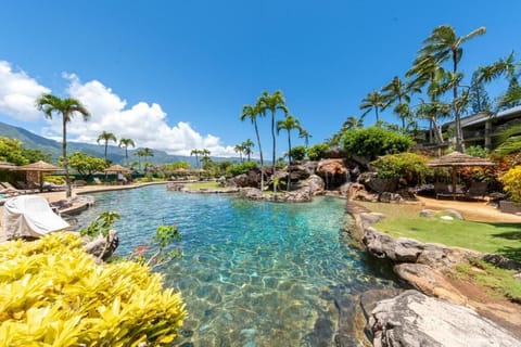 Dive into the sparkling lagoon pool with mountain views.