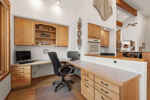 Dedicated workspace just off the kitchen with built-in desk and natural light — perfect for remote work, planning the day’s adventures, or checking in while enjoying your mountain getaway.