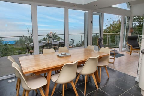 Dining area with table and chairs and arm chairs