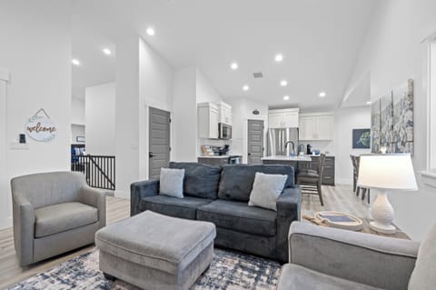 Living room looking into the kitchen and dining areas