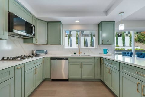 Modern kitchen featuring stainless steel appliances and all your cooking essentials.