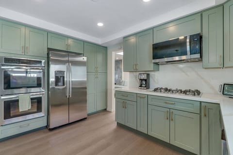Fully stocked kitchen ready for your stay — includes stainless appliances