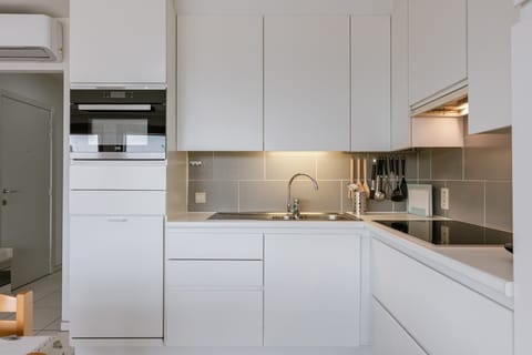 Fully equipped white kitchen ready for your favorite homemade dishes
