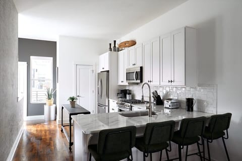 The Austen: Pull up a seat at the kitchen bar—perfect for casual bites, morning coffee, or keeping the chef company.