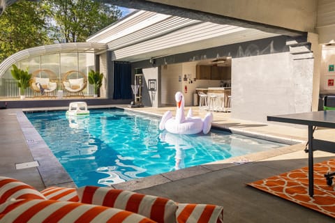 Ingound heated pool that encloses for the cold months.