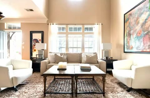 From front door to the Living Room with Vaulted 2-story ceiling.  New windows.