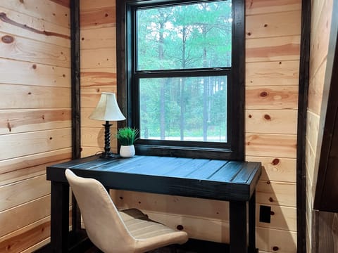 Spacious upstairs King suite featuring a dedicated desk for remote work or journaling in peace.