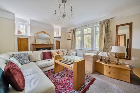 Comfortable living room with a large corner sofa and bookshelves