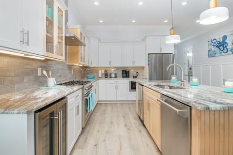 Spacious modern kitchen with sleek appliances and bright lighting