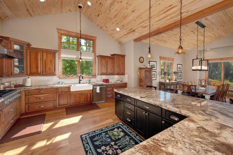 Fully stocked gourmet, chef's kitchen.