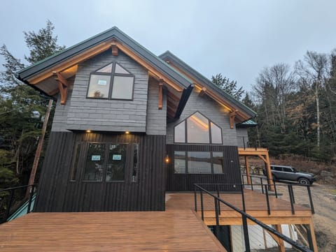 Lakeside exterior with large patio off of the dining room has outdoor furniture