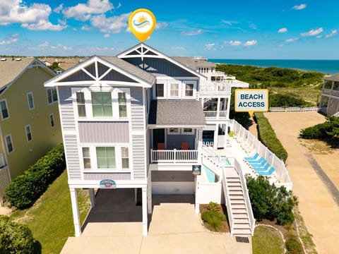 Beautiful semi-oceanfront home featuring spacious decks, private pool, and ocean views—just 175 feet from the sand.