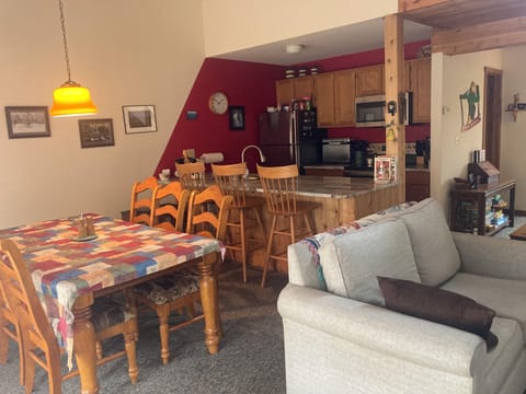 Fully stocked kitchen including with 3 chairs at the counter