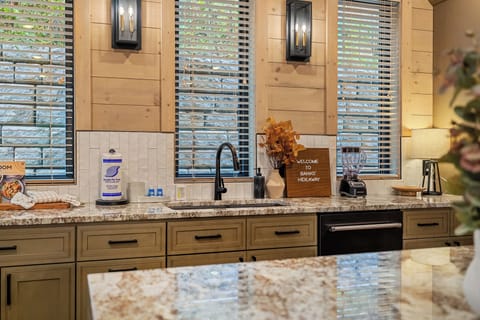 Bright, welcoming kitchen with spacious granite counters