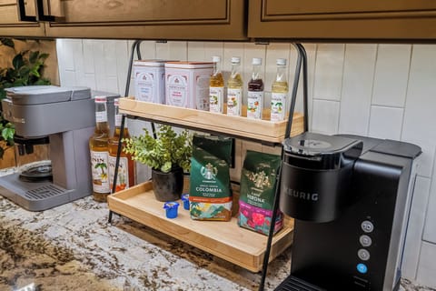 Fully stocked coffee bar with premium brews, syrups and Keurig machines