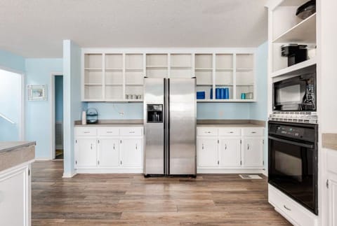 Spacious kitchen and dining area perfect for cooking and sharing meals together.