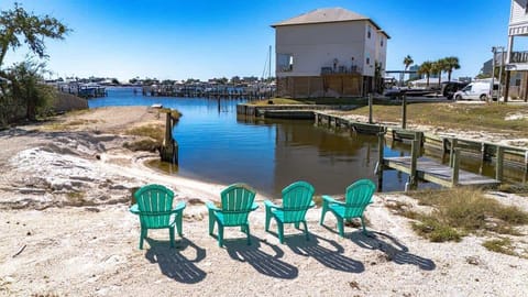 Relax by the water with stunning lagoon views, comfortable Adirondack seating, and peaceful access to the marina perfect for morning coffee, sunset chats, or simply unwinding by the shoreline.