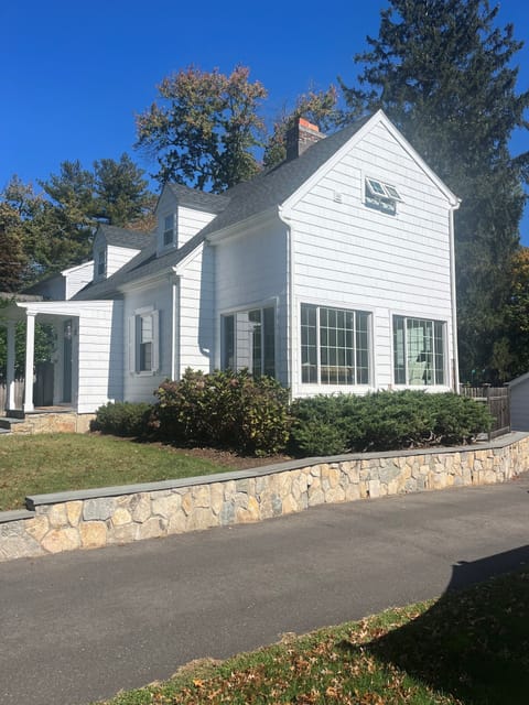 Side of home with television nook, windows all open