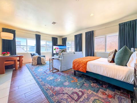 Bright, spacious studio with cozy lounge area and stylish decor