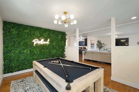 Spacious area equipped for both pool and ping pong, perfect for hours of fun and friendly competition.