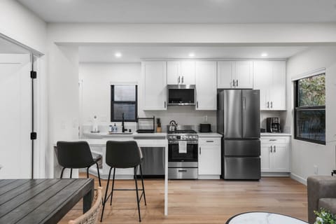 Second gorgeously remodeled kitchen and dining area with plenty of space to cook and enjoy meals