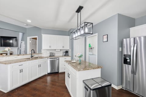 Channel your inner French foodie! Fully equipped for all your cooking needs, this spacious kitchen has plenty of space for you to unlock your culinary genius! 