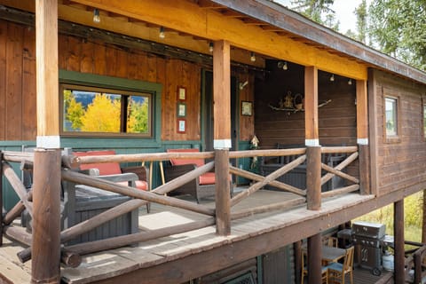 Relax on your private covered deck with mountain views, outdoor seating, and BBQ grill for perfect alpine evenings.