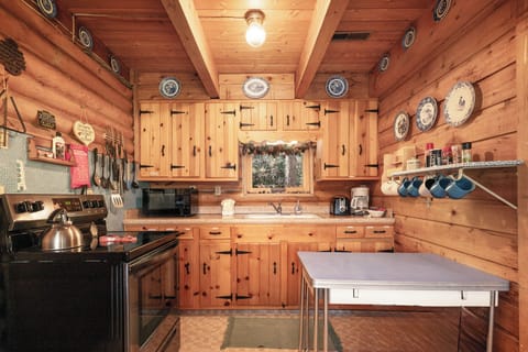 Step into your charming rustic kitchen where exposed beams and warm wood create the perfect atmosphere for cooking memorable meals together.