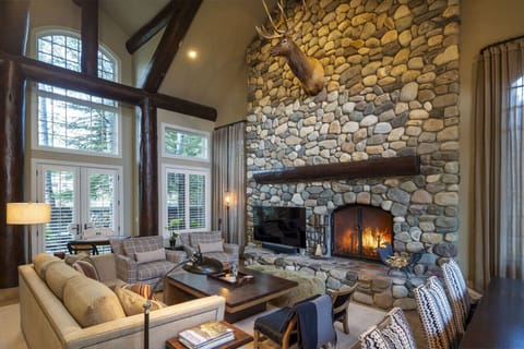 Cozy Great Room Featuring an Elegant Stone Fireplace