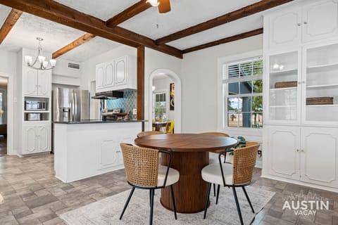 Cook, chat, and unwind in this inviting kitchen-meets-dining space.