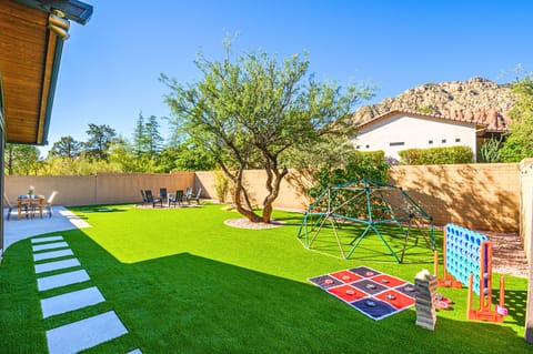 Enjoy a spacious, fenced yard with lawn games and seating areas. 