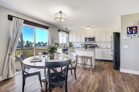 Enjoy a cozy breakfast nook that seats four. Additional bar seating at the island makes it perfect for morning coffee or casual meals.