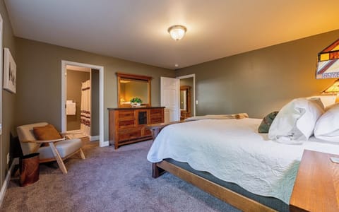 Primary bedroom with King bed, ensuite bathroom and large closet.