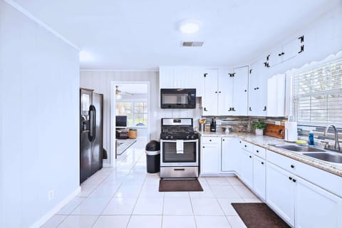 Gourmet Kitchen: Whip up culinary delights in this bright, stylish space with ample counter space!