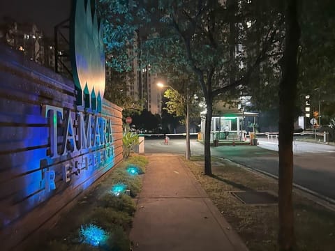 Tamara Residence entrance and guardhouse at night.